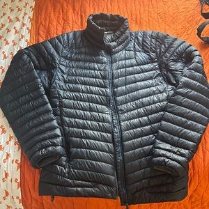 Norrona Medium Navy Iofoten super lightweight down jacket.
